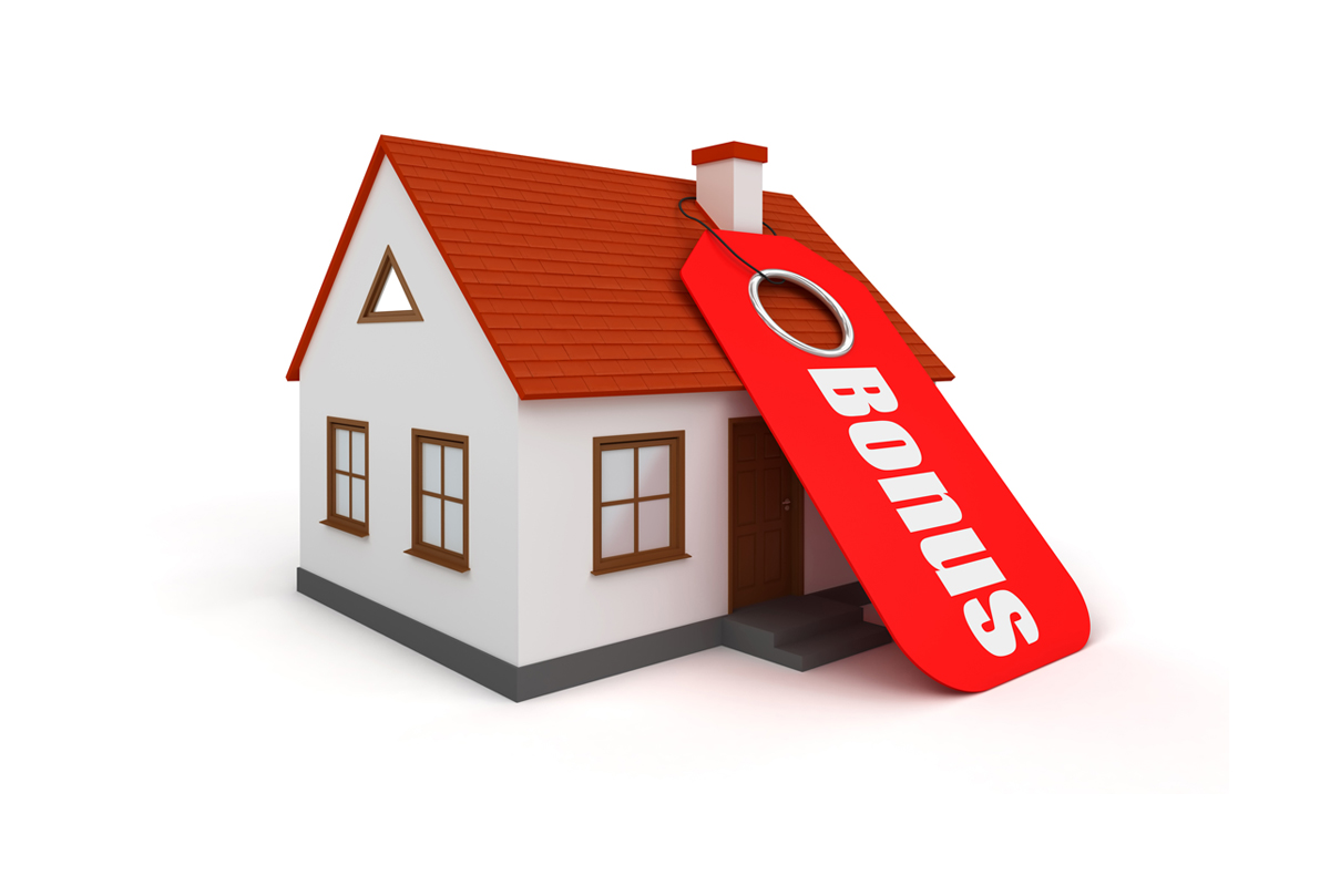 casa con cartello sul camino e scritta bonus